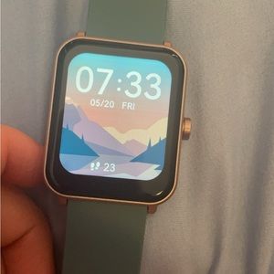 Smart watch rose gold blue band. Comes with charger. Heart rate and SPO2